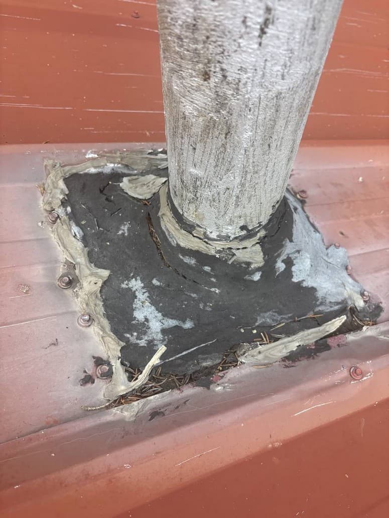 Vent boot with peeling mastic, photographed on an inspection