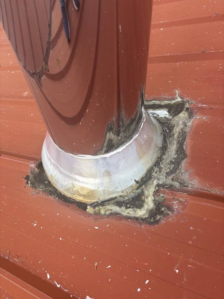Chimney jack with old mastic cracked and pulled back