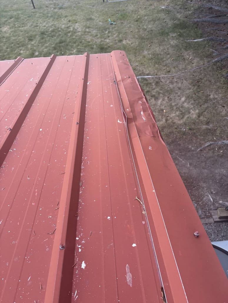 Gap down the rake where water can get behind the metal onto the fascia