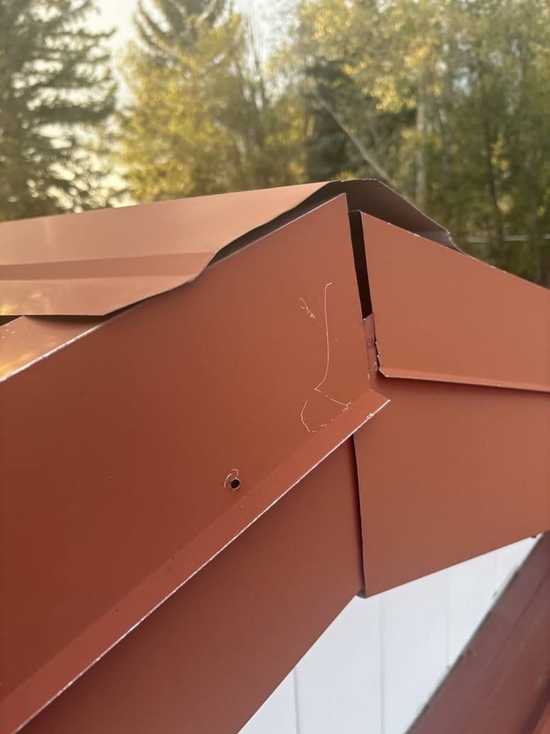 Photo 11 — Corner of the trim. Pieces do not meet. Empty screw hole.