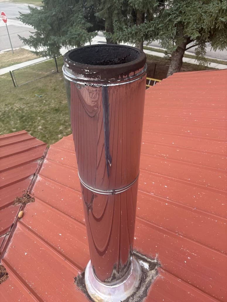 Photo 14 — No cap. Soot on the rim.